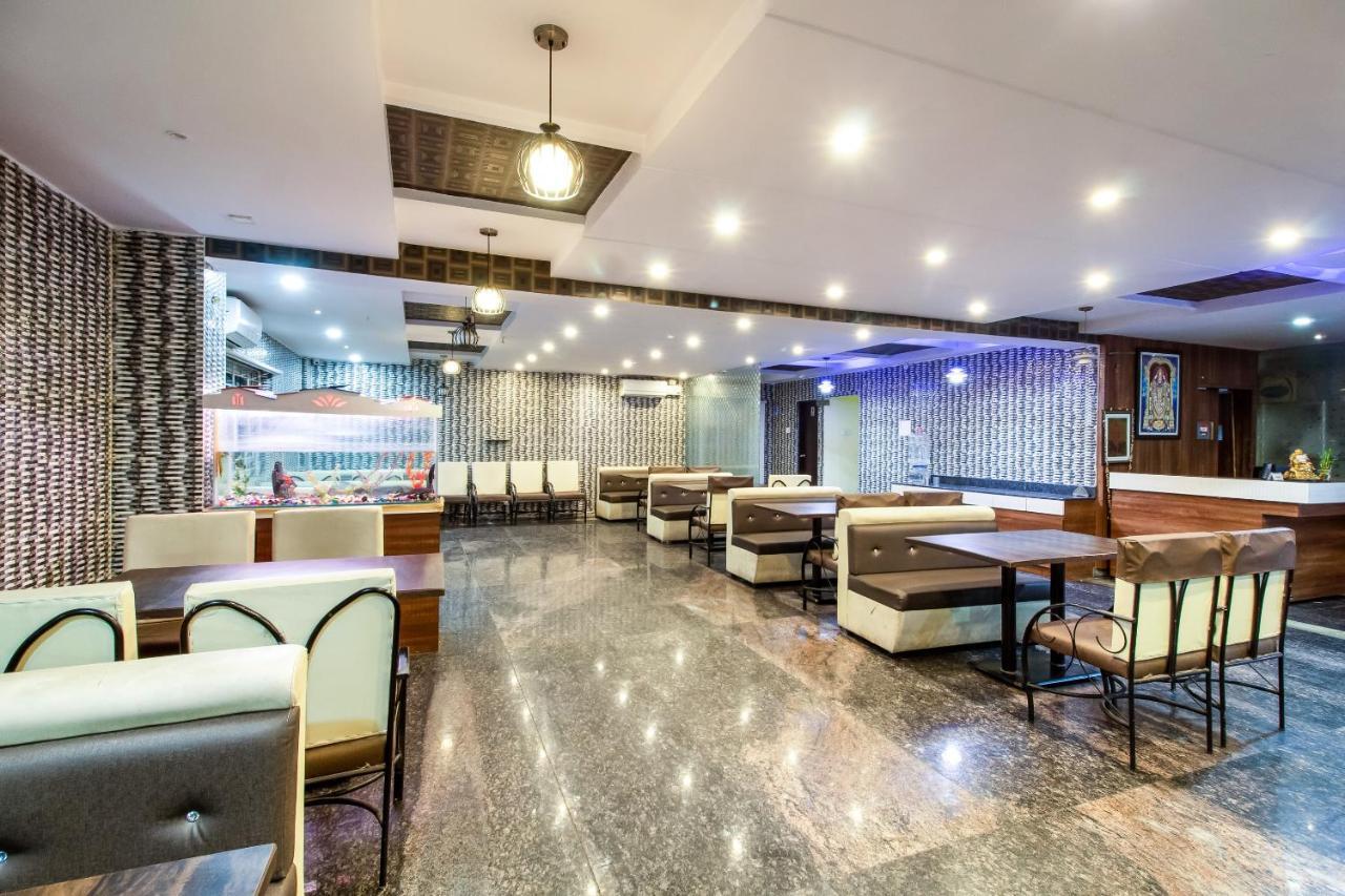 Hotel Capital O Sri Navya Grand Near Nexus